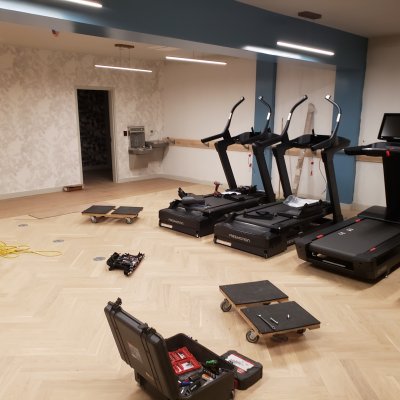 Setting up gym equipment and machines
